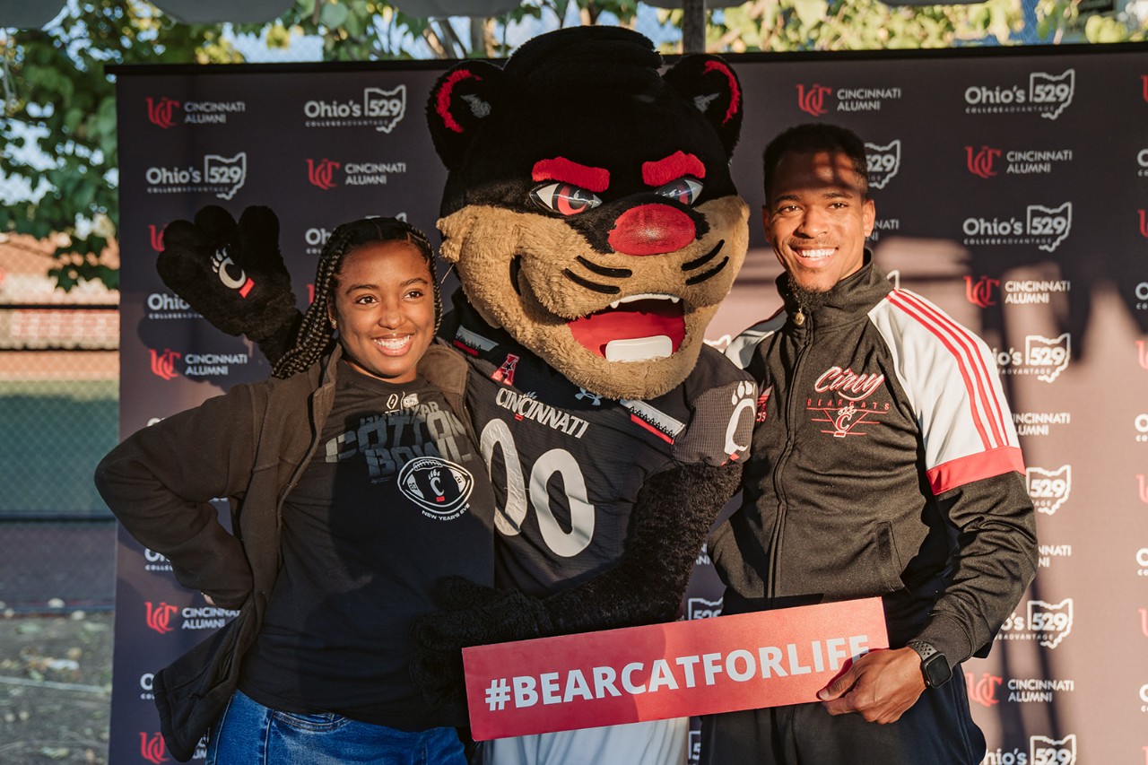 alumni smiling with the Bearcat