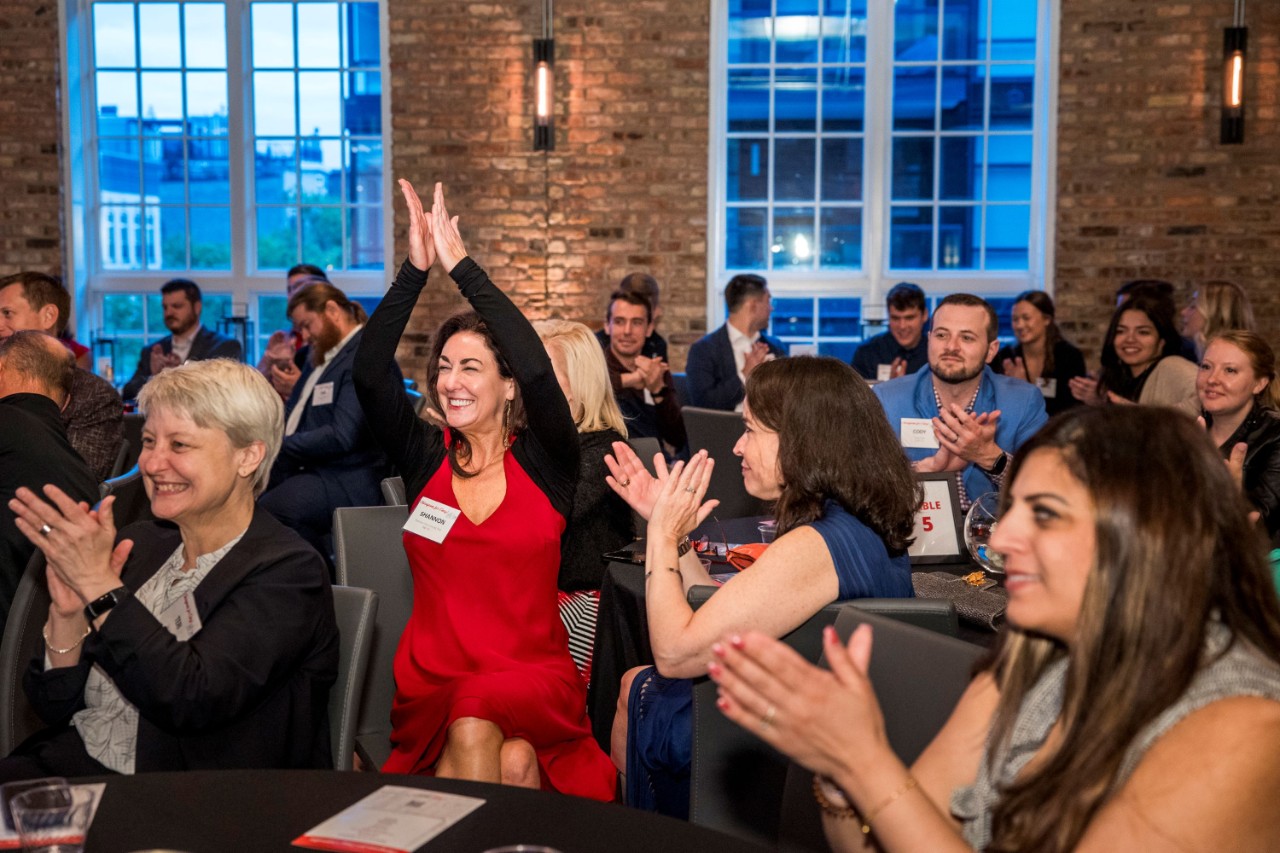 Alumni clapping at the Chicagoans for Cincy! Celebration