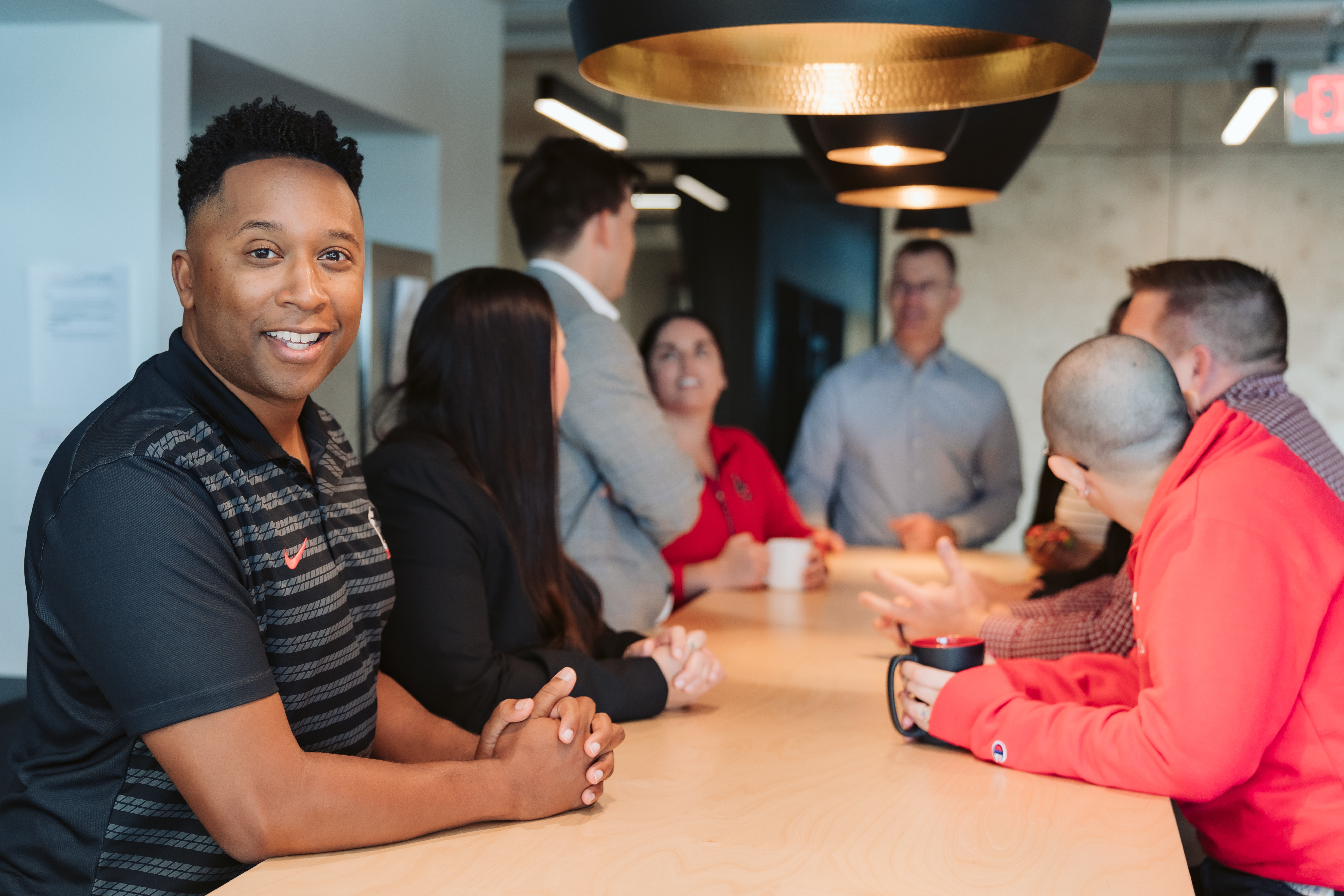 Group of people sitting at a table talking