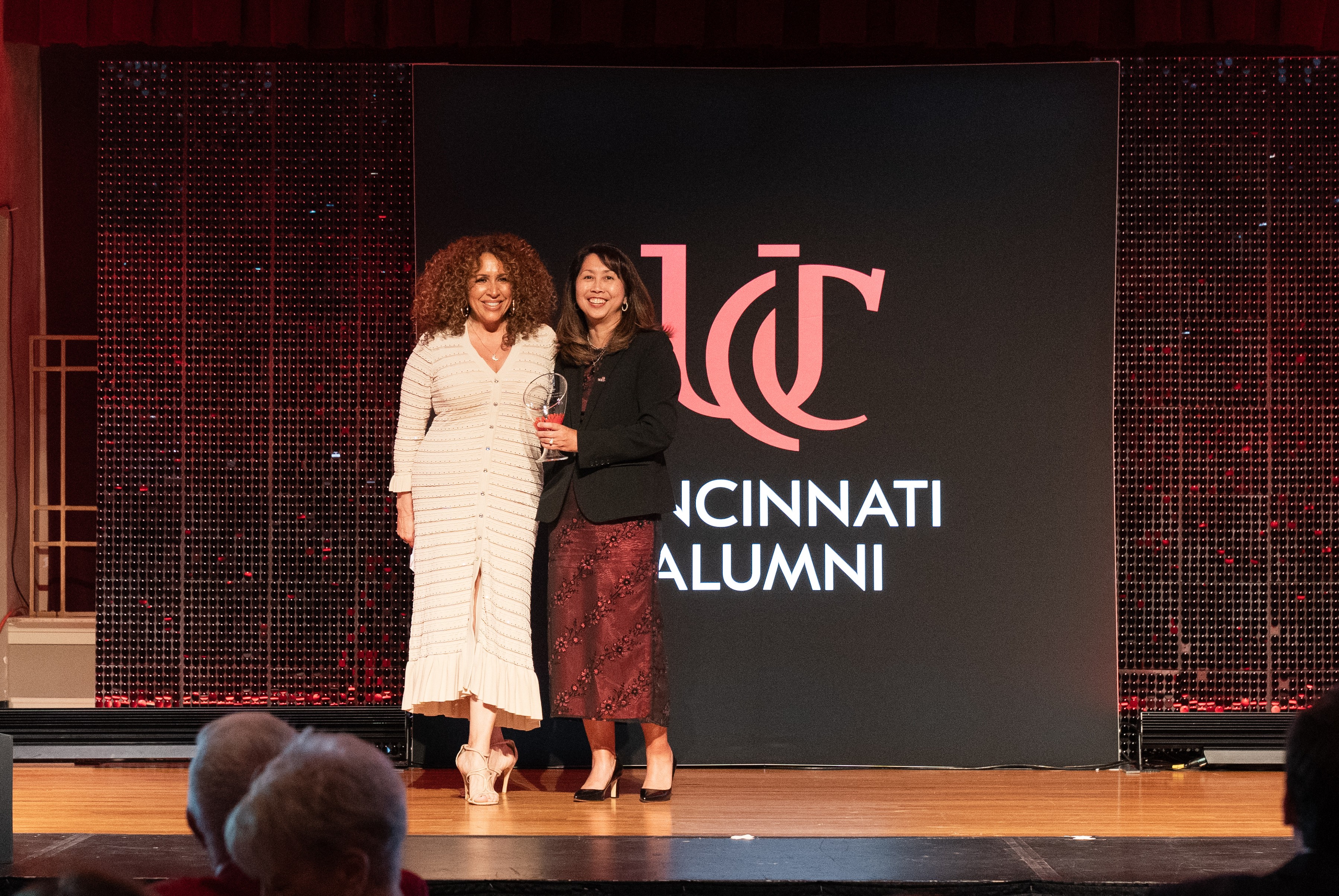 Woman accepting award on stage